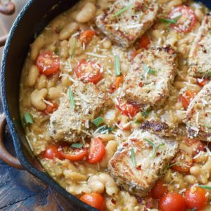 Make these easy one pan Garlic Herb Pork Medallions with Tuscan White Beans for a hearty comforting dish ready in under 30 minutes!