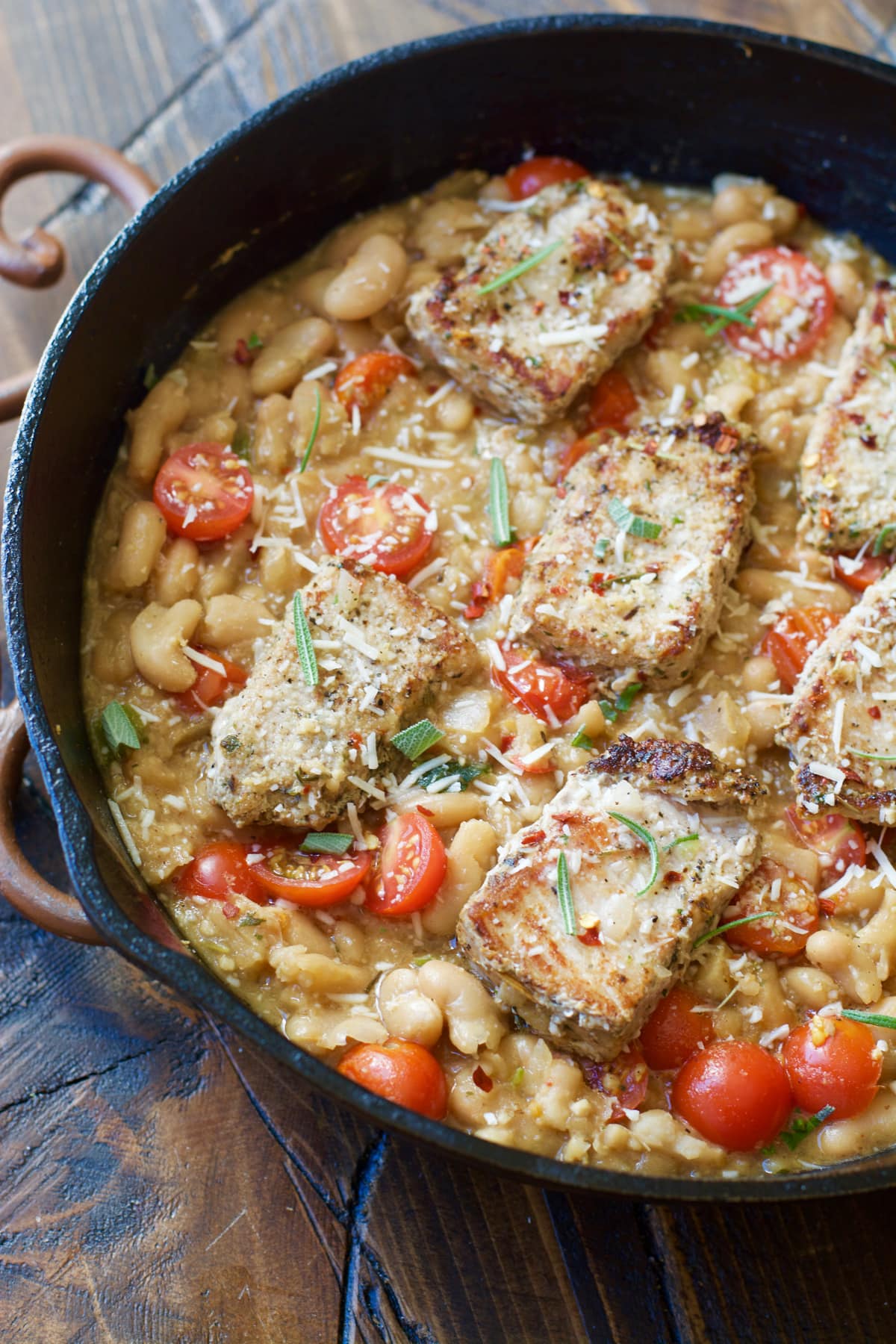 Make these easy one pan Garlic Herb Pork Medallions with Tuscan White Beans for a hearty comforting dish ready in under 30 minutes!