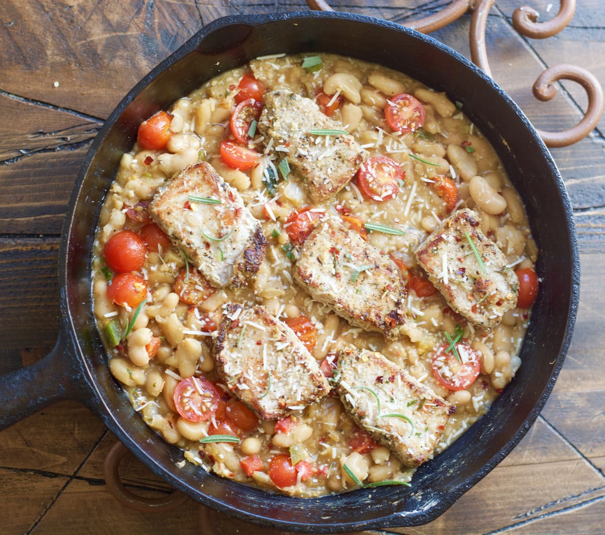 Make these easy one pan Garlic Herb Pork Medallions with Tuscan White Beans for a hearty comforting dish ready in under 30 minutes!