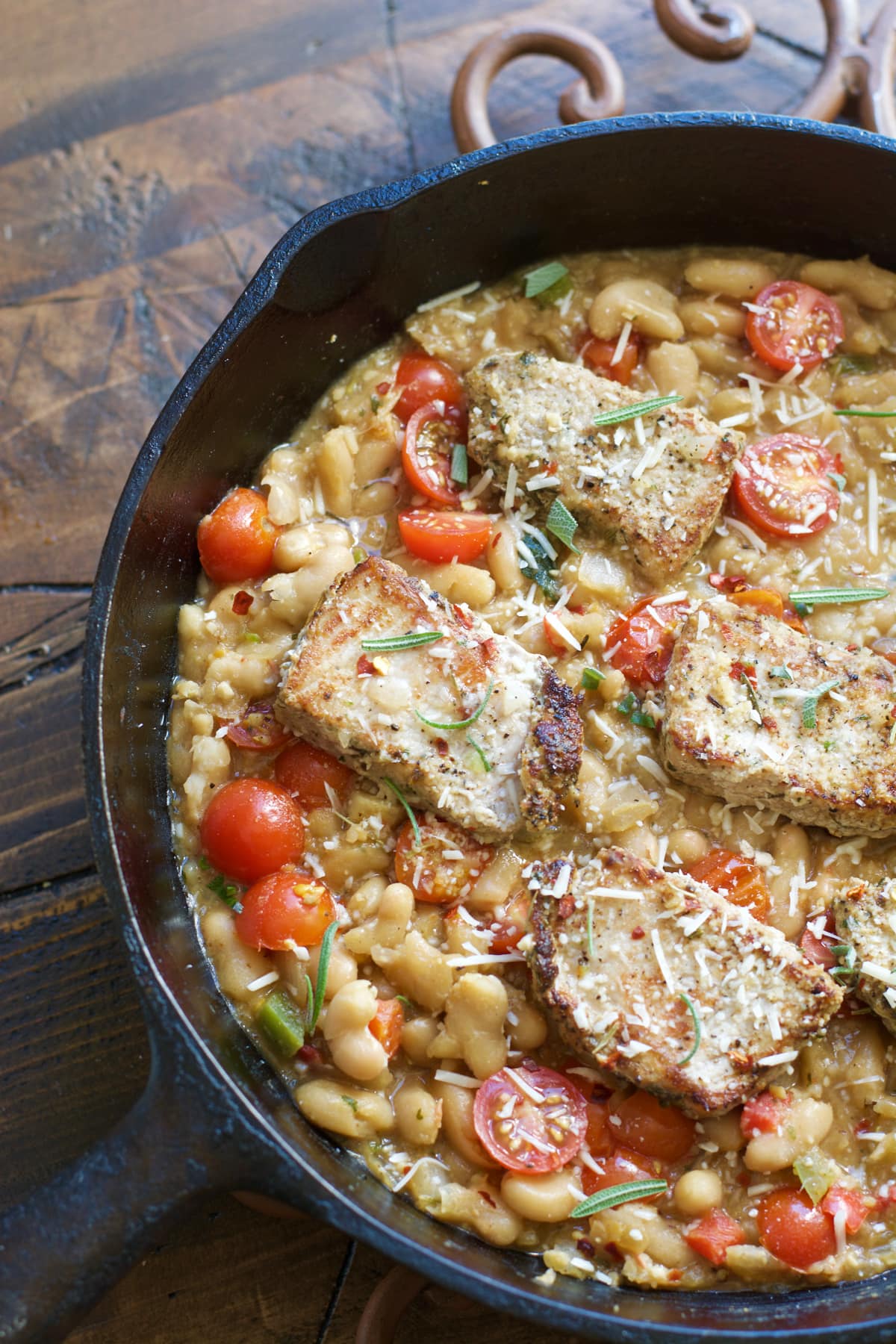 Make these easy one pan Garlic Herb Pork Medallions with Tuscan White Beans for a hearty comforting dish ready in under 30 minutes!