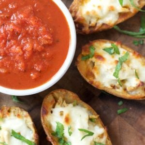 You can make these Chicken Parmesan Stuffed Potato Skins with just five simple ingredients! This easy recipe will become a family favorite!