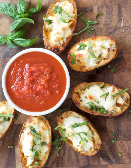 You can make these Chicken Parmesan Potato Skins with just five simple ingredients! This easy recipe will become a family favorite!