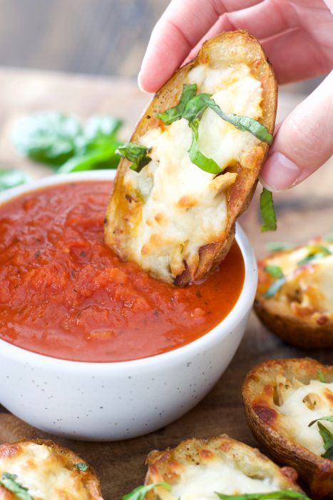 You can make these Chicken Parmesan Stuffed Potato Skins with just five simple ingredients! This easy recipe will become a family favorite!