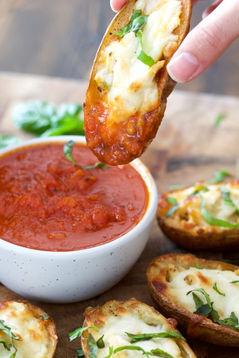 You can make these Chicken Parmesan Potato Skins with just five simple ingredients! This easy recipe will become a family favorite!