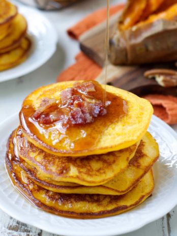 These Sweet Potato Bacon Pancakes are the perfect mix of sweet and savory! Cover with warm maple syrup for an easy holiday breakfast!