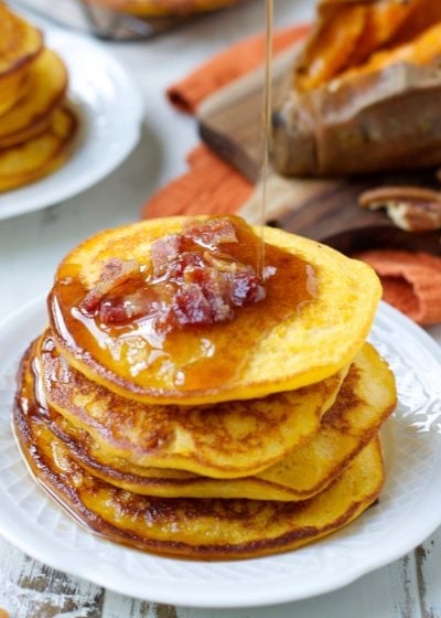 These Sweet Potato Bacon Pancakes are the perfect mix of sweet and savory! Cover with warm maple syrup for an easy holiday breakfast!