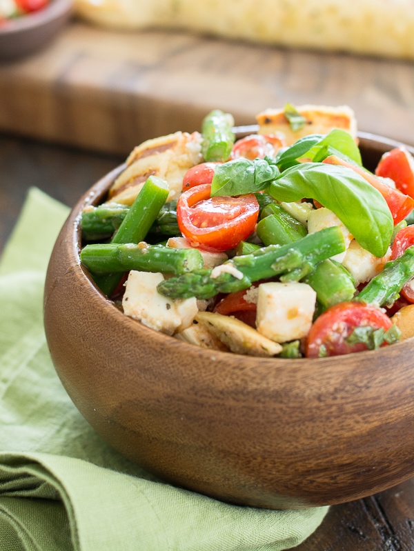 This delicious Asparagus and Tomato Panzanella Salad comes together with just a few simple ingredients! A healthy and delicious salad you will love all Summer long!
