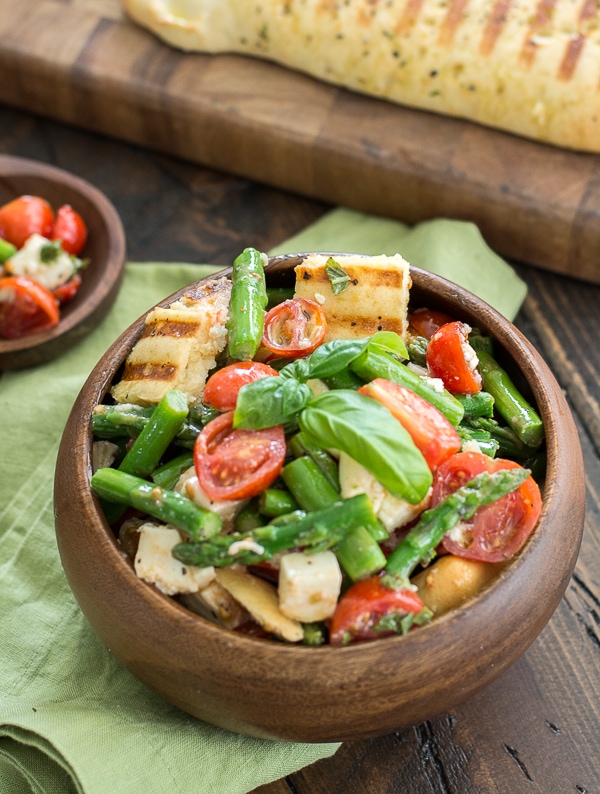 This delicious Asparagus and Tomato Panzanella Salad comes together with just a few simple ingredients! A healthy and delicious salad you will love all Summer long!