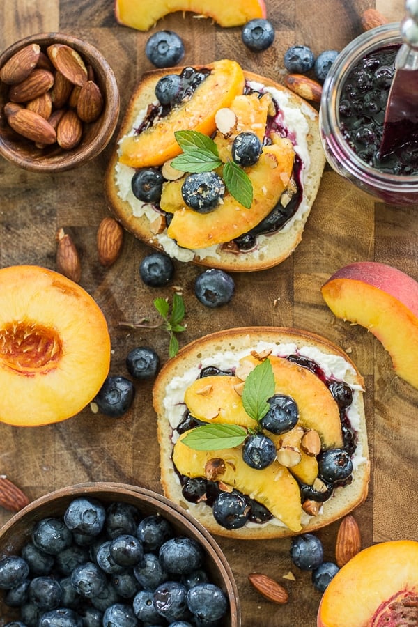 This simple Sweet Peach Bruschetta combines the best flavors of Summer! Fresh peaches, blueberries and mint make for an impressive combination!