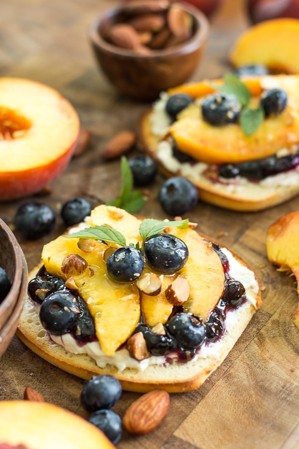This simple Sweet Peach Bruschetta combine the best flavors of Summer! Fresh peaches, blueberries and mint make for an impressive combination! 