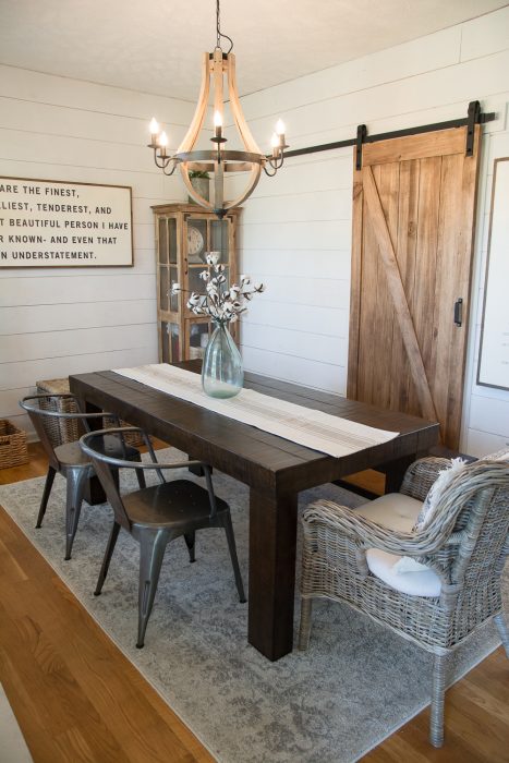 DIY Farmhouse Dining Room! See how we added shiplap walls, a barn door and new lighting to create the perfect #farmhouse look on a budget! And how you can do it too!