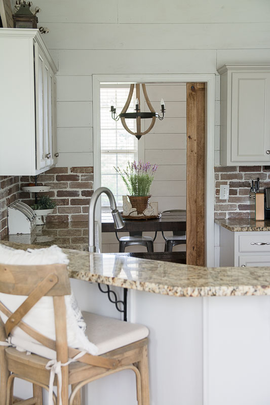 Update your kitchen with an Easy DIY Brick Backsplash! This affordable project is perfect for beginners who are looking for that classic farmhouse style!