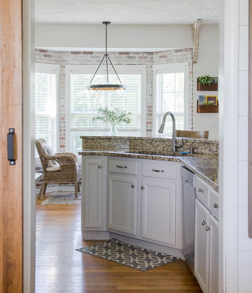 Update your kitchen with an Easy DIY Brick Backsplash! This affordable project is perfect for beginners who are looking for that classic farmhouse style! #diy #fixerupperstyle