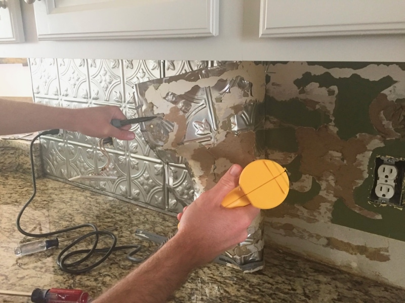 Easily remove a glued on backsplash with our step by step photos and tips! Updated a dated kitchen is easier than you might think, follow along as we remodel our farmhouse!