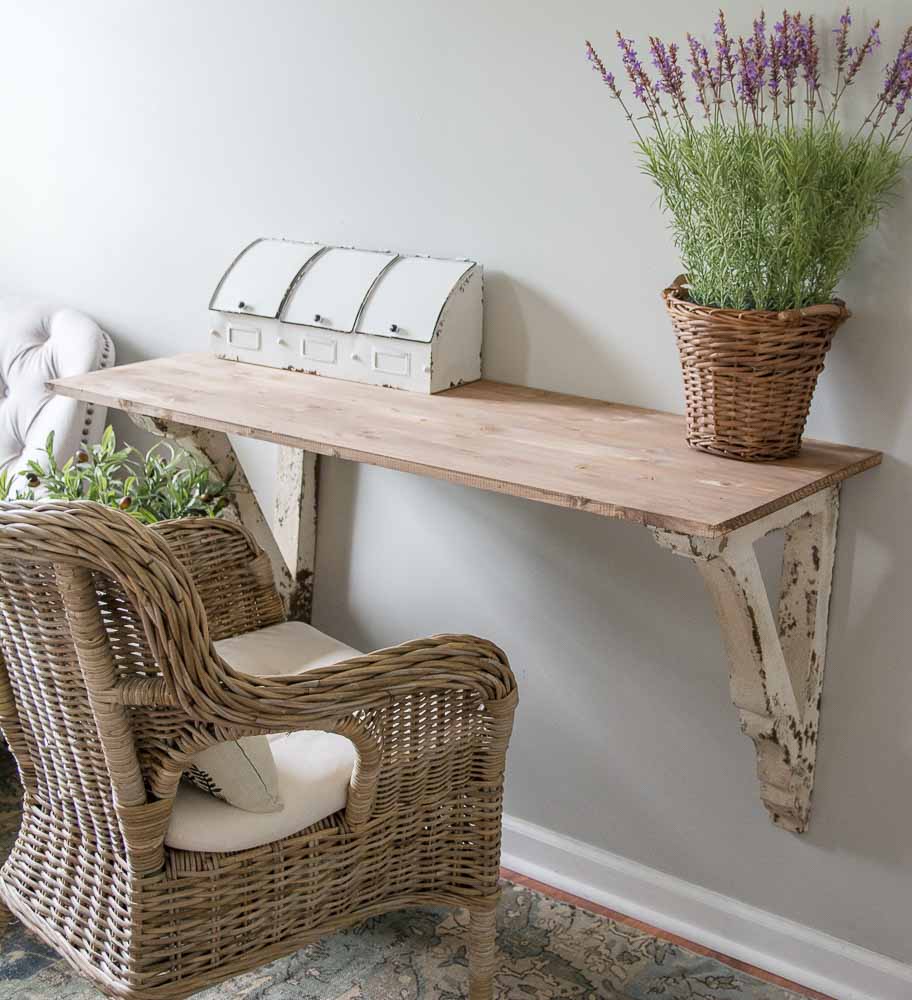 This super easy DIY Corbel Table adds a ton of farmhouse charm to any space! See how you can easily create this look in three simple steps!