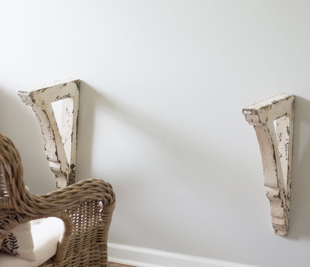 This super easy DIY Corbel Table adds a ton of farmhouse charm to any space! See how you can easily create this look in three simple steps!