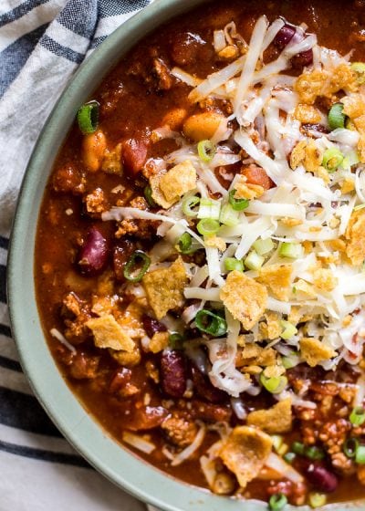 This is the Best Turkey Chili recipe! Browned turkey, two kinds of beans, tomatoes and spices make this an easy dinner you will love! Slow cooker option also!