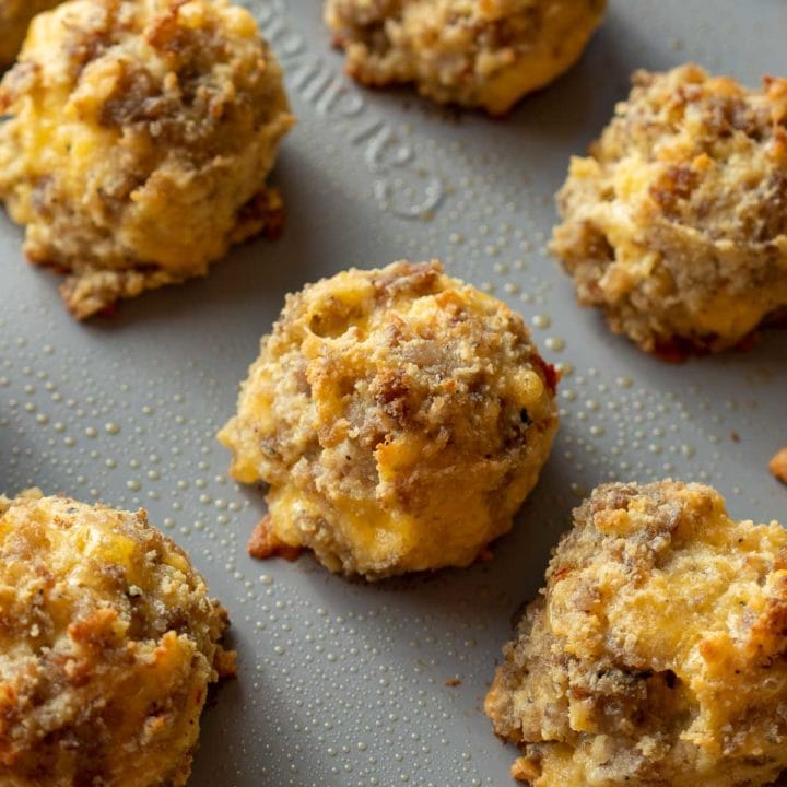 Overhead view of sausage, egg, and cheese bites on a baking sheet