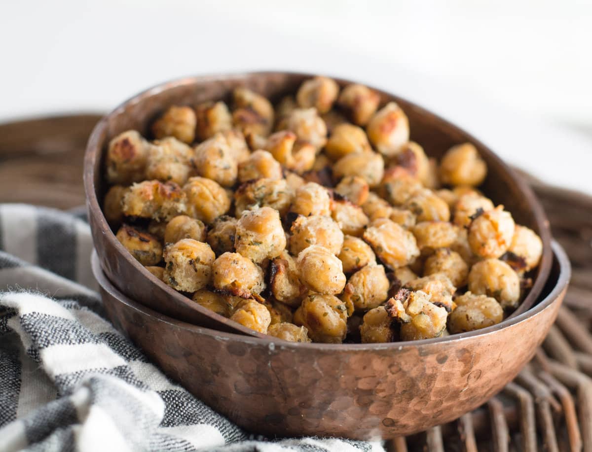 oven roasted chickpeas in a bowl, which is stacked in another bowl 