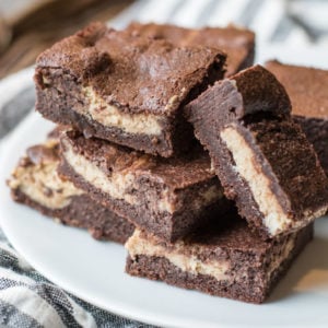 Keto Peanut Butter Cheesecake Brownies are packed with rich, fudgy chocolate and swirled with a rich peanut butter cheesecake layer! All low carb and keto approved!