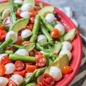 Asparagus, Tomato and Avocado Salad in a creamy lemon vinaigrette! Healthy, quick and delicious! The perfect low carb summer salad!