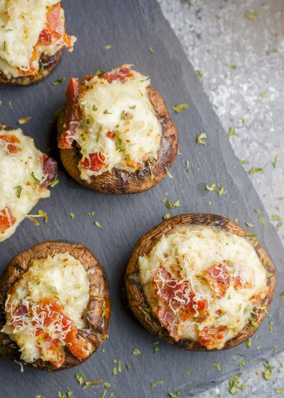 These Crab and Bacon Stuffed Mushrooms are packed with creamy cheese, salty bacon and lumps of crab meat. The perfect low carb, keto, five ingredient appetizer! 