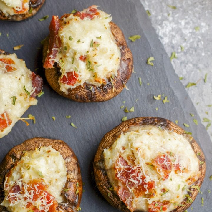 These Crab and Bacon Stuffed Mushrooms are packed with creamy cheese, salty bacon and lumps of crab meat. The perfect low carb, keto, five ingredient appetizer! 