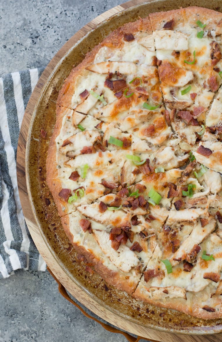 This easy Keto Chicken Bacon Ranch Pizza has a perfectly crispy low carb crust and is loaded with grilled chicken and bacon! Only 3 net carbs per slice!