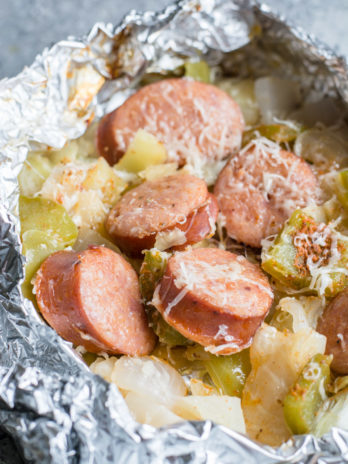 Keto Sausage and Cabbage Foil Packs are loaded with spicy sausage, bell pepper, onion, and cabbage in a cajun butter sauce! A perfect low carb meal for camping or grilling out! #keto