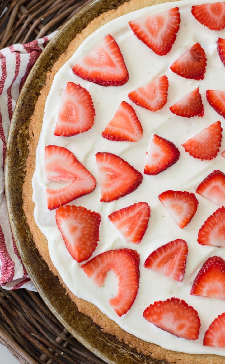  This Strawberry Limeade Keto Fruit Pizza features a sweet almond flour cookie crust, a refreshing lime frosting and a sweet strawberry topping! The perfect low carb dessert for all of your summer cookouts!  