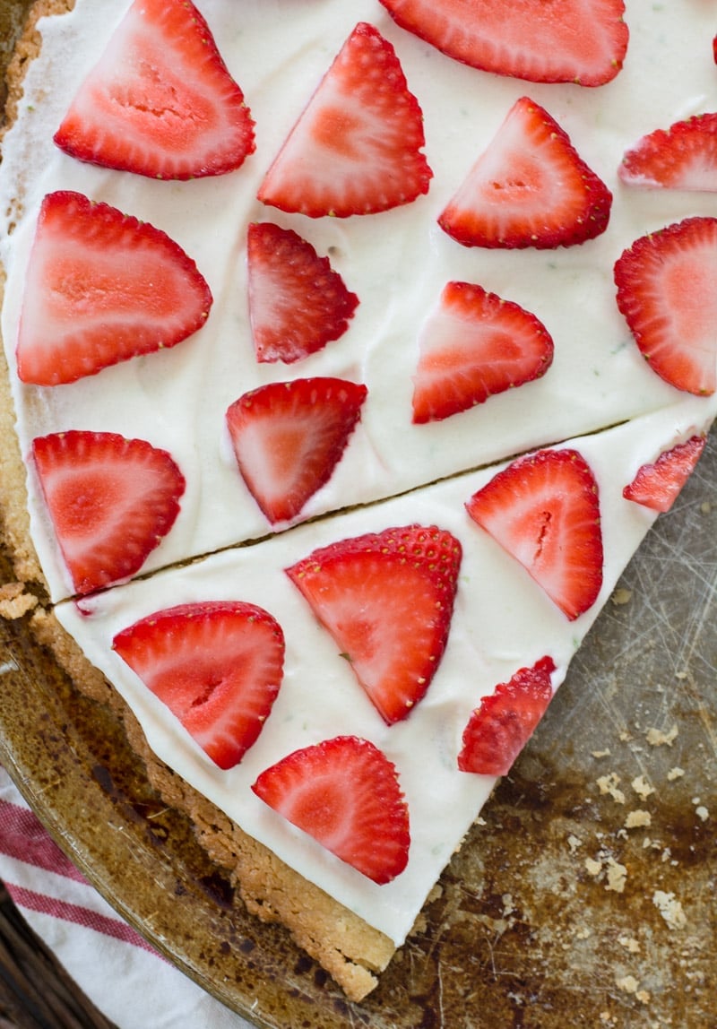  This Strawberry Limeade Keto Fruit Pizza features a sweet almond flour cookie crust, a refreshing lime frosting and a sweet strawberry topping! The perfect low carb dessert for all of your summer cookouts!  