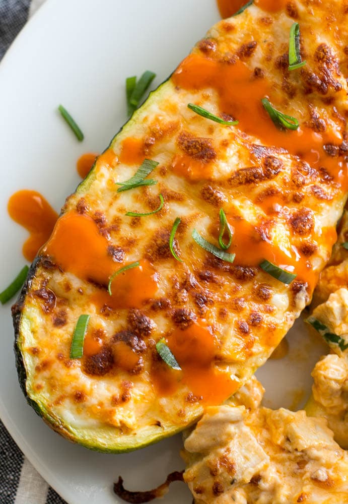 Overhead view of a baked buffalo chicken zucchini boat. 