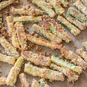 You will love these Keto Zucchini Fries for a low carb side! These fries are breaded with almond flour, parmesan and spices and baked until perfectly crispy!  #keto