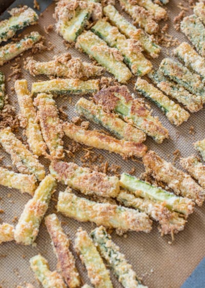 You will love these Keto Zucchini Fries for a low carb side! These fries are breaded with almond flour, parmesan and spices and baked until perfectly crispy!  #keto