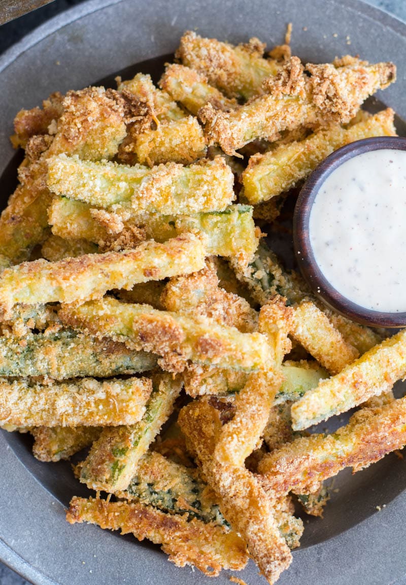 You will love these Keto Zucchini Fries for a low carb side! These fries are breaded with almond flour, parmesan and spices and baked until perfectly crispy!  #keto