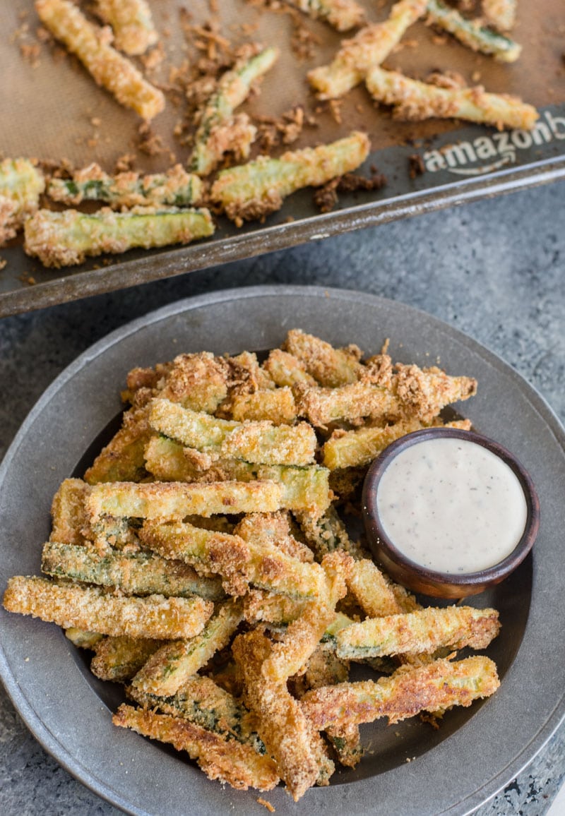 You will love these Keto Zucchini Fries for a low carb side! These fries are breaded with almond flour, parmesan and spices and baked until perfectly crispy!  #keto