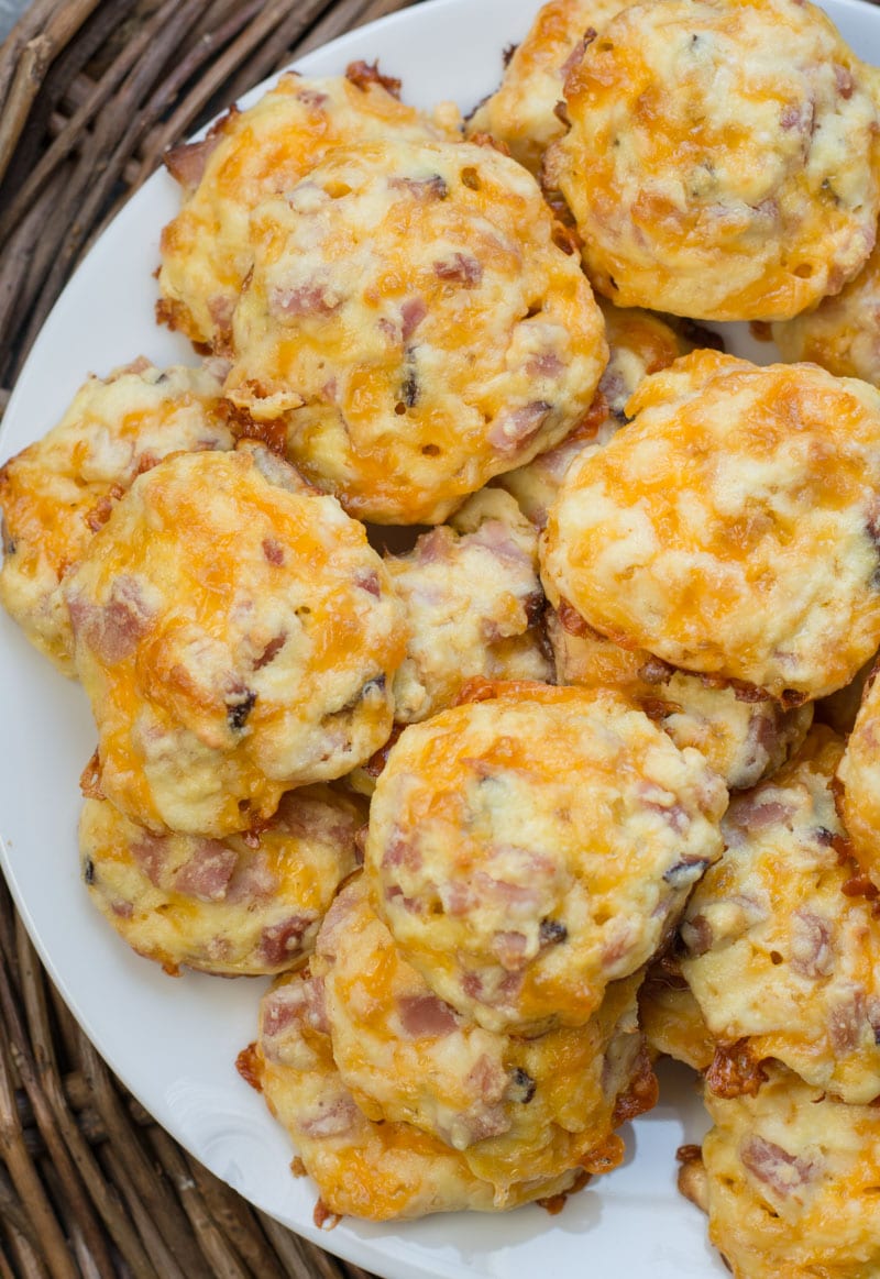 Ham and cheese homemade egg bites piled high on a plate. 