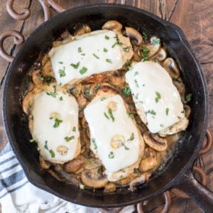 This One Pan Mushroom Chicken is covered in Swiss cheese and swimming in a creamy mushroom sauce! This easy dinner is ready in under 30 minutes and has just 2 net carbs per serving! #keto