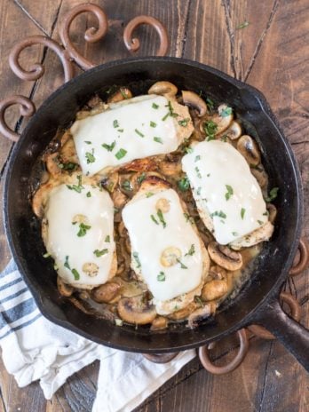 This One Pan Mushroom Chicken is covered in Swiss cheese and swimming in a creamy mushroom sauce! This easy dinner is ready in under 30 minutes and has just 2 net carbs per serving! #keto