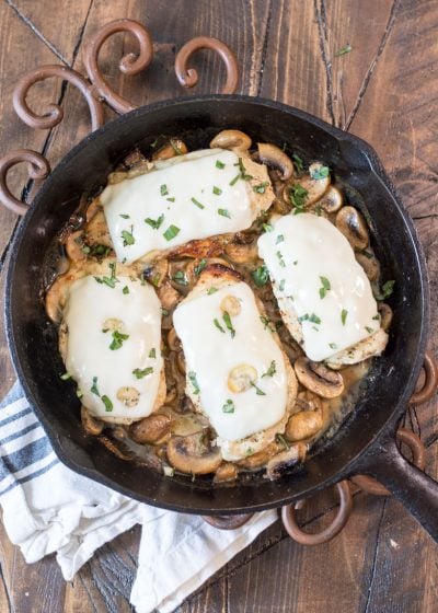 This One Pan Mushroom Chicken is covered in Swiss cheese and swimming in a creamy mushroom sauce! This easy dinner is ready in under 30 minutes and has just 2 net carbs per serving! #keto