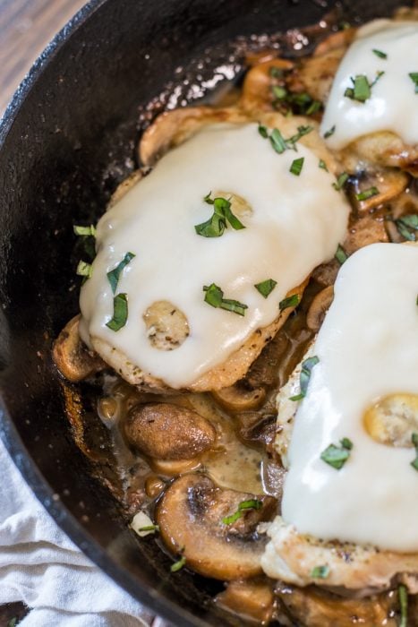 This One Pan Mushroom Chicken is covered in Swiss cheese and swimming in a creamy mushroom sauce! This easy dinner is ready in under 30 minutes and has just 2 net carbs per serving! #keto