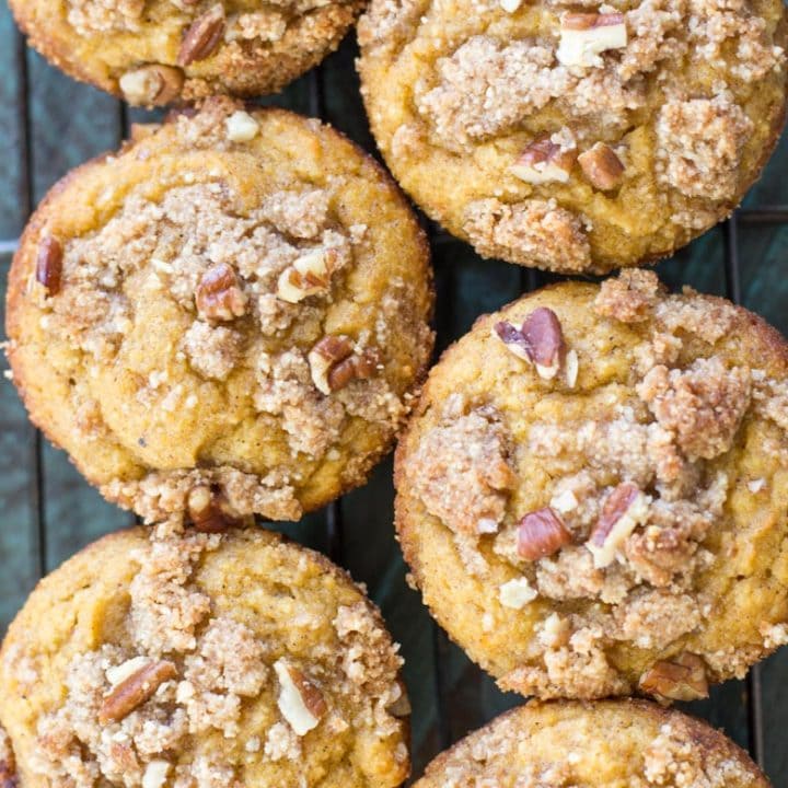 These Keto Pumpkin Muffins are packed with pumpkin spice flavor and topped with a pecan crumble topping! At just 5 net carbs this is a low carb treat you will enjoy all fall long! #keto