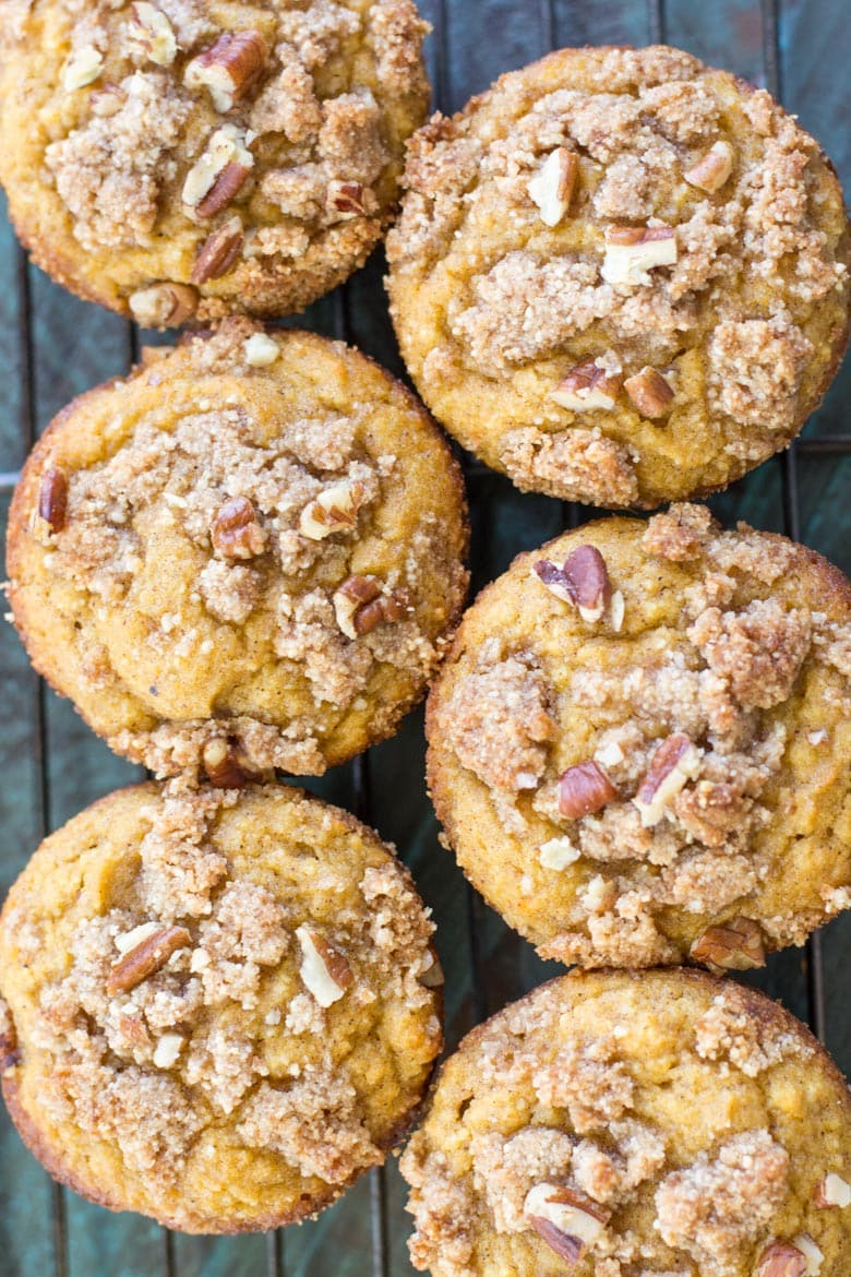 These Keto Pumpkin Muffins are packed with pumpkin spice flavor and topped with a pecan crumble topping! At just 5 net carbs this is a low carb treat you will enjoy all fall long! #keto