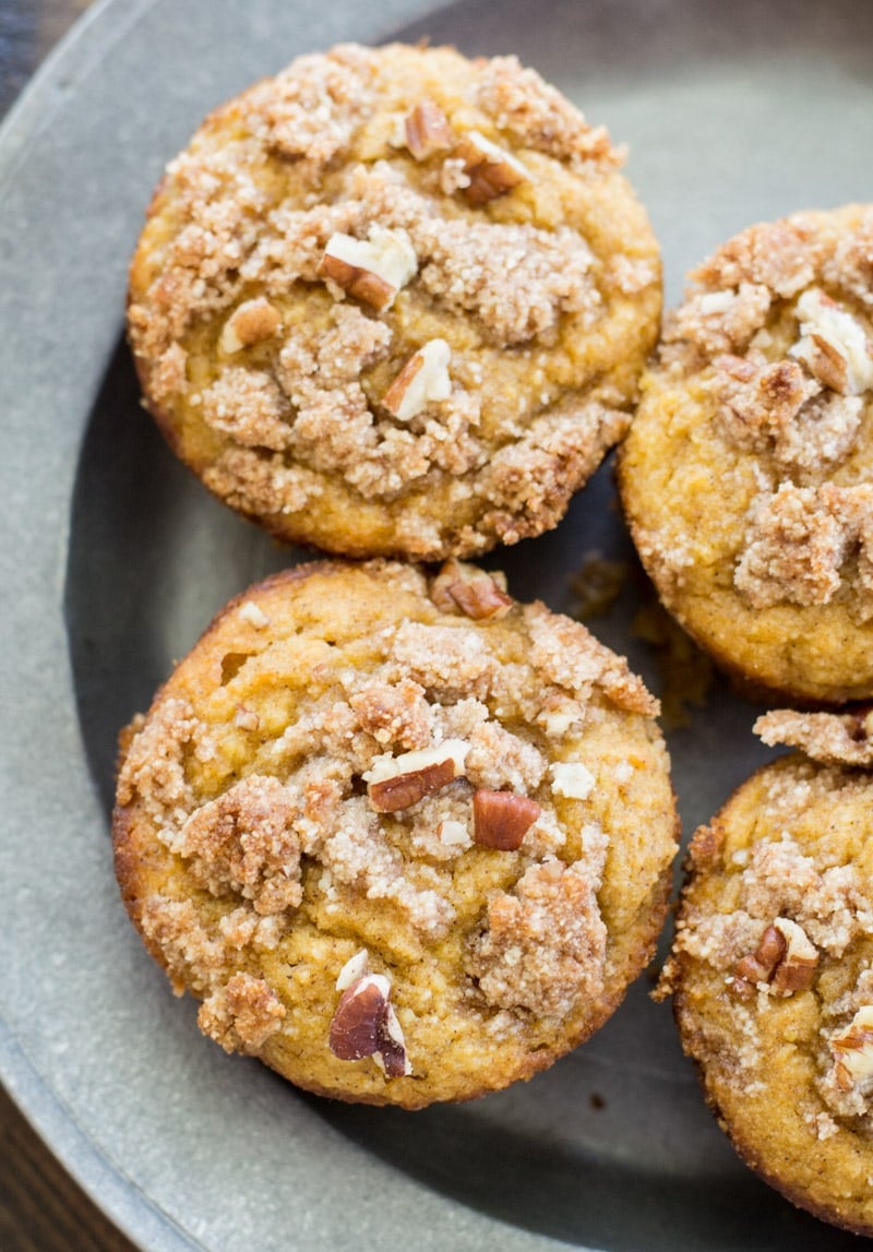 These Keto Pumpkin Muffins are packed with pumpkin spice flavor and topped with a pecan crumble topping! At just 5 net carbs this is a low carb treat you will enjoy all fall long! #keto