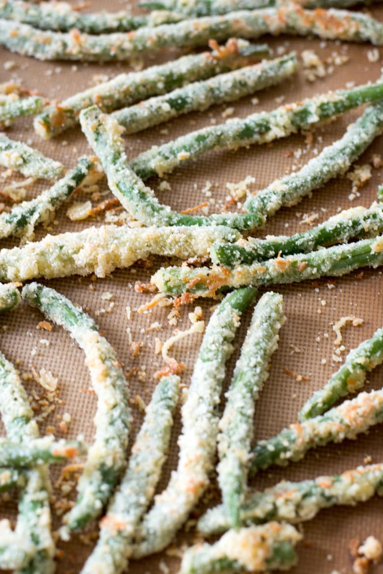 baked green bean french fries on a baking sheet 