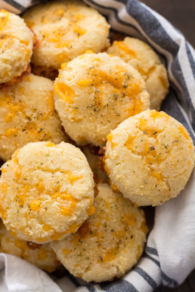 a basket of cheddar keto biscuits