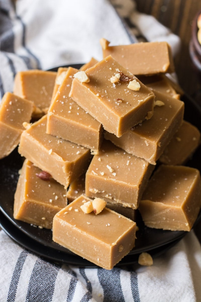 keto peanut butter fudge piled on a dark plate 