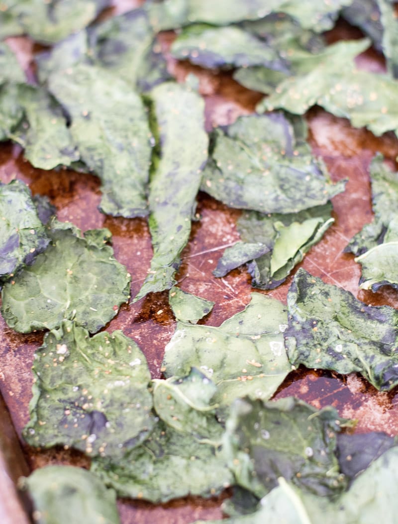 oven baked kale chips on a baking sheet 