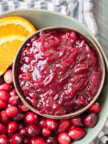 This easy three ingredient Low Carb Cranberry sauce is essential for your keto holiday spread! Learn how to make small batch, large batch and three different flavors with this easy guide. #keto