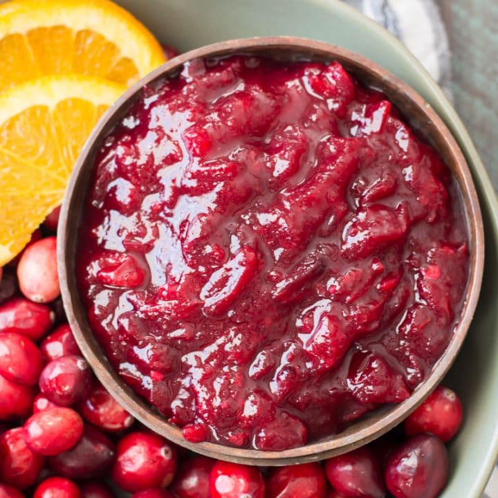 This easy three ingredient Low Carb Cranberry sauce is essential for your keto holiday spread! Learn how to make small batch, large batch and three different flavors with this easy guide. #keto